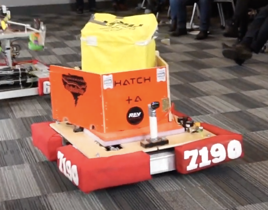 Flippy Boi, our Power Up 2018 Robot, carrying a Power Cube.
